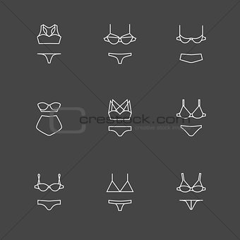 White line bra and panties icons set on black