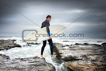 Crossing the Rocks to Surf
