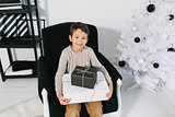 Boy with Christmas gifts