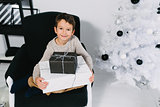 Boy with Christmas gifts