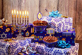 jewish holiday Hanukkah with menorah, wooden dreidels