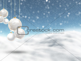 Christmas baubles on defocussed winter landscape