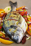 Raw whole sea bream fish and vegetables ingredients