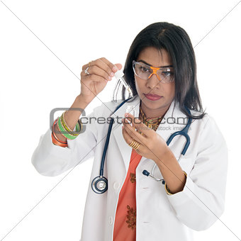 Female doctor doing medical test at lab