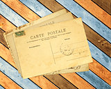 Retro post cards on ancient wooden planks