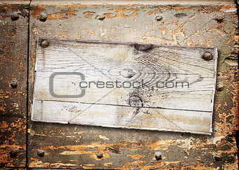 Old wooden board with cracked paint surface