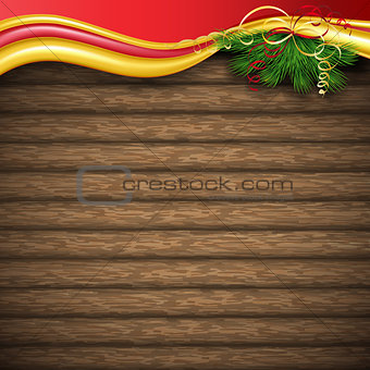 Christmas tree, holly and decorative elements on background of boards