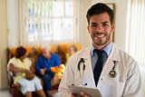 Portrait Of Happy Young Doctor Working In Medical Clinic