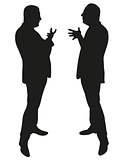 two men standing and talking to each other