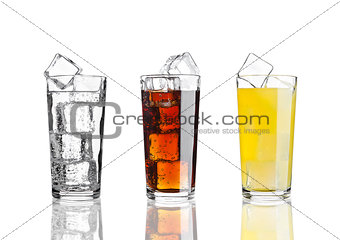 Glasses of cola orange soda lemonade with ice
