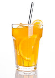 Glass of healthy orange juice with ice and straw
