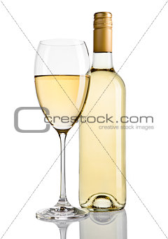 Bottle and glass of white wine with reflection