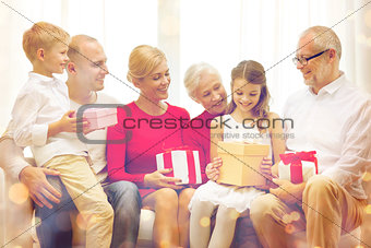 smiling family with gifts at home