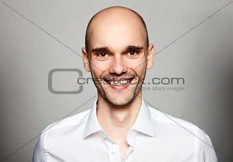Smiling Man in White Shirt