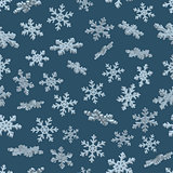 3D snowflakes. Blue seamless background