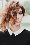 portrait of a beautiful woman with dark red hair