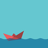 One red paper boat