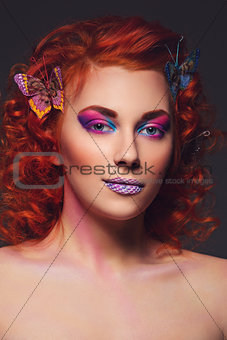Red hair girl with butterflies