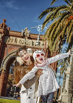 mother and daughter near Arc de Triomf having fun time