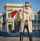 elegant tourist woman shopper in Milan, Italy standing
