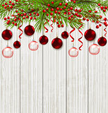 Green fir branch and red decorations 