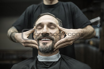 Face massage in barbershop