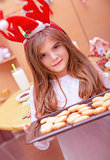 Little girl making Christmas cookies