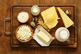 Assorted dairy products (milk, yogurt, cottage cheese, sour cream) rustic still life