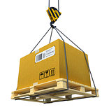 Pallet with cardboard lifted by crane
