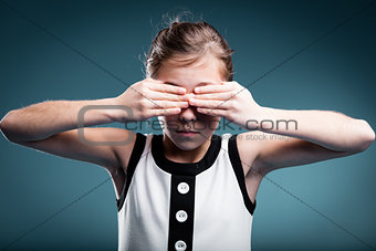 girl preventing herself to see
