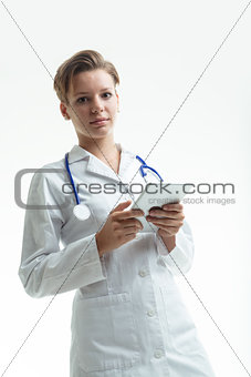 doctor looking to you and waiting holding a digital tablet