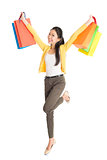 Happy Asian woman with shopping bags