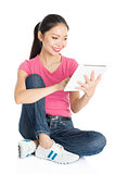 Young Asian girl student using tablet pc