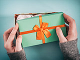 female hands opening gift box