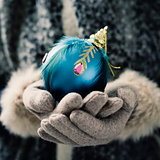 woman with an ornamented christmas ball