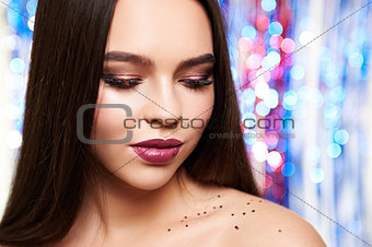 Woman make-up with shiny glitter and snow
