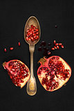 Pomegranate isolated on black background, top view.