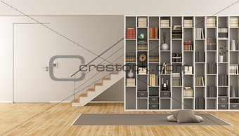 Living room with bookcase and staircase