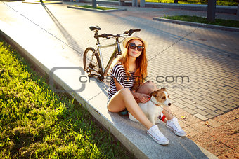 Smiling Hipster Girl with Pet and Bike in Summer