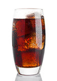 Glass of cold cola soda drink with ice cubes  