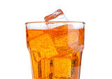 Glass of orange energy soda drink with ice