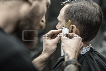 Doing haircut in barbershop