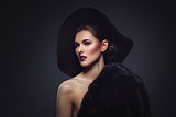Beautiful girl in fur coat and hat