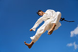 Extreme Sport Hispanic Athlete Jumping During Karate Fight