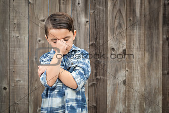 Frustrated Mixed Race Boy With Hand on Face