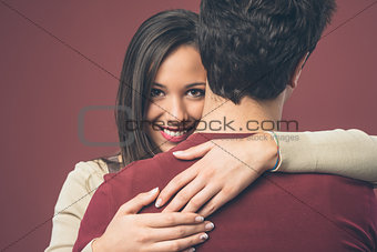 Smiling girl with her boyfriend