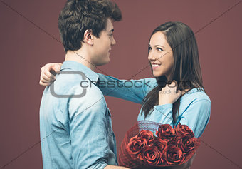 Smiling woman receiving a love gift
