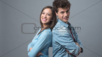 Young couple back to back