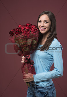 Happy young woman with roses