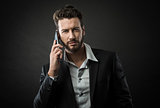 Young businessman having a phone call